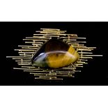 A modern 18k gold mounted tigers eye set brooch, the triangular cabochon cut tigers eye 37mm x 24mm,