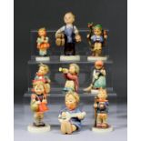 A small collection of Hummel pottery figures, including - "Apple Boy", 4ins high, "Boy Cobbler