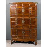 A Chinese panelled elm and metal mounted cupboard, fitted four frieze drawers, three cupboards under