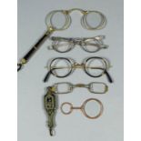 A pair of late Victorian gold coloured metal and tortoiseshell folding lorgnettes, the tapered