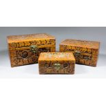 A nest of three Chinese camphorwood boxes of small size, the exterior all similarly carved with