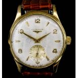 A 1950s gentleman's Longines 9ct gold cased wristwatch, the silvered dial with alternating Arabic