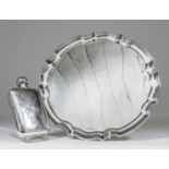 An Elizabeth II silver circular salver with shaped and moulded rim, on three scroll feet, 12ins