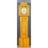 A 19th Century stripped pine longcase clock by Charles Levy of Truro, the 12ins arched painted