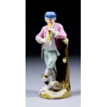 A 19th Century Meissen porcelain figure of a standing man in 18th Century dress playing a