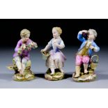 A pair of 19th Century Meissen porcelain figures, each modelled as a child, he holding a garland