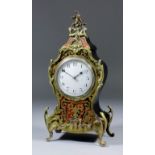 An early 20th Century French red tortoiseshell Boulle and brass mounted mantel timepiece of "Louis