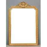 A gilt framed rectangular overmantel mirror of "18th Century" design, with fretted leaf and scroll