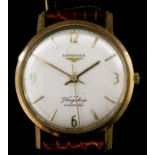 A gentleman's 9ct gold Longines Flagship automatic wristwatch, the silvered dial quarter set with