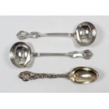 A pair of Victorian silver sauce ladles, the moulded rims with shaped terminals cast with leaf