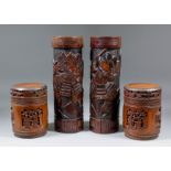 A pair of Japanese bamboo brush pots carved with Samurai warriors, each 12.5ins (31.7cm) high, a