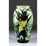 A Moorcroft pottery vase, shape No. 393, tube lined and decorated in colours with "Lamia" design,