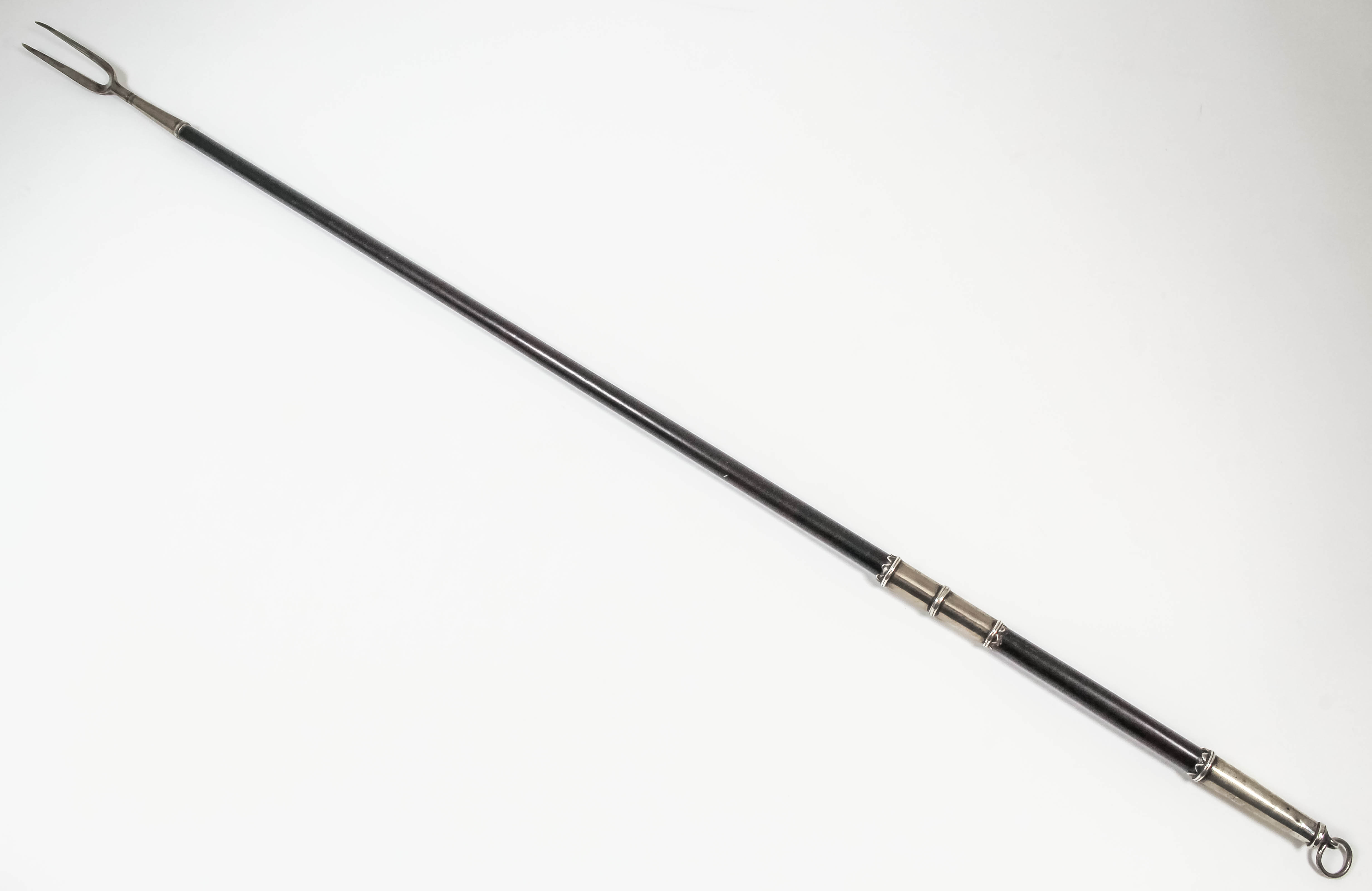 A rare Charles II silver mounted toasting fork with turned wood handle (possibly laburnum) with