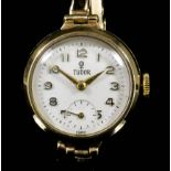 A lady's 9ct gold cased Tudor wristwatch, the white dial with Arabic numerals and subsidiary seconds