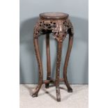 A Chinese stained wood circular jardiniere stand with pink veined marble flush panel to top and