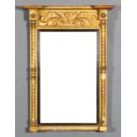 An early 19th Century English rectangular pier glass with moulded cornice, leaf scroll frieze and