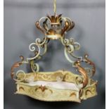 A green painted and gilt decorated ceiling light, the two tier circular top with four leaf capped