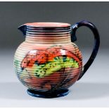 A Moorcroft pottery bulbous reeded jug decorated in colours with a fish design, 4.75ins high (