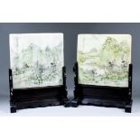 A pair of Chinese alabaster table screens, each painted with river and mountain landscapes to one