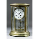 An early 20th Century French brass and bevelled glass cased oval "Four Glass" mantel clock, No.