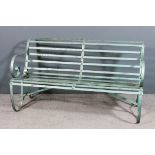 A wrought iron garden bench with green painted finish, 59ins wide x 33ins high