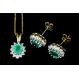 A pair of modern 9k gold emerald and diamond earrings (for pierced ears), the oval cut emerald of