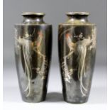 A pair of Japanese bronze vases inlaid with cockerels on flowering prunus branches in silvery and