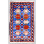 A Shirvan rug woven in colours with two rows, each of five octagonal medallions filled with cross