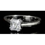 A modern platinum mounted solitaire diamond ring, the Princess cut stone of approximately .70ct (