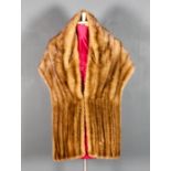 A 1980's blonde mink stole by A. Newman of Cape Town, 70ins x 15.5ins with brown satin lining, a