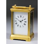 A late 19th Century French carriage clock, the white enamel dial with Roman numerals, to the eight