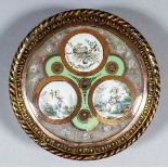 A late 18th Century Continental tortoiseshell and gold inlaid circular snuff box with three