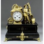 A late 19th Century French gilt spelter and black slate mantel clock by A.M., No. 2464 * 64, the 3.