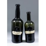 Two late 18th Century sealed green glass cylindrical wine bottles with moulded string rims and