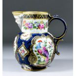 A 19th Century porcelain mask jug decorated in the "Worcester" manner in coloured enamels with