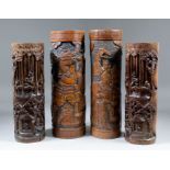 A pair of Japanese bamboo brush pots carved with Samurai warriors, each 14.25ins (36.4cm) high, a