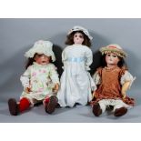 Two French Unis bisque headed dolls - "251" doll with closing blue eyes, open mouth showing two