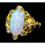 A modern 18ct gold mounted opal and diamond ring, the oval cabochon cut opal of approximately 2.5ct,