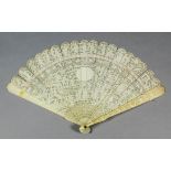 A Chinese "Cantonese" ivory fan, the eighteen carved sticks with figures in pavilions and gardens,
