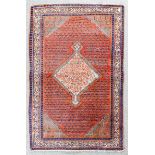 A Bidjar rug woven in colours with a central angular pole medallion and conforming spandrels, the