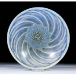 A Lalique moulded and pale blue opalescent glass "Poissons No. 1" (Pattern No.3211), the circular