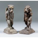 A pair of Black Forest carved anthropomorphic figures of a bear and dog in hunting dress, 6.75ins