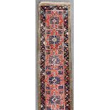 A Turkish Dobac runner woven in colours with ten stylised star motifs, on a terracotta ground,