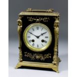 A late 19th Century French ebonised and gilt brass mounted rectangular mantel clock, the 3.5ins