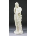 Late 19th/early 20th Century carved alabaster figure of a standing classically attired women, 17.