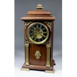 A late 19th/early 20th Century Continental walnut and gilt metal mounted mantel clock, the 4.75ins