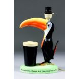 A Carlton Ware pottery Guinness Toucan pattern advertising electric table lamp, 11.5ins high