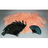 A 1920s pale apricot ostrich cape with chiffon lining, a 1920s tortoiseshell and ostrich feather