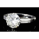 A modern platinum mounted diamond solitaire ring, the old cut stone of approximately 2.5ct, with