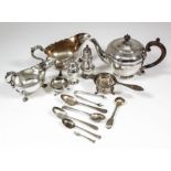 A George V silver circular teapot of panelled form, with moulded girdle to body, wood finial and C-